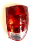 2001-2005 Ford Ranger Driver Side Tail Light Clear & Red No Bulbs Visteon. Fixed Price $29.00.